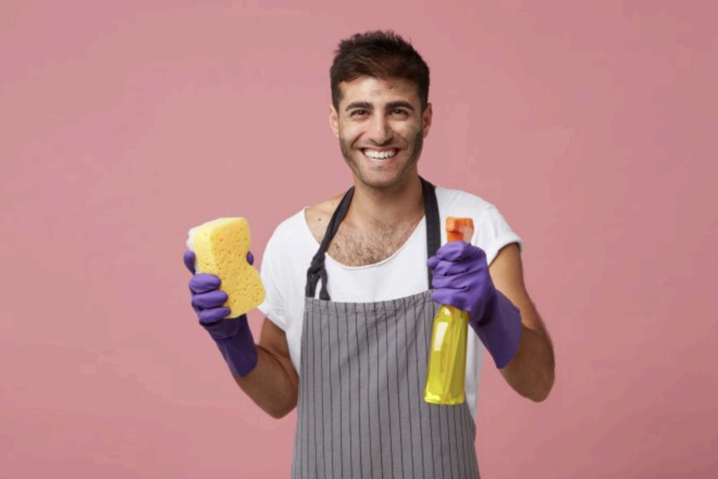 Street Sign cleaning Day image of a man holding cleaning supplies